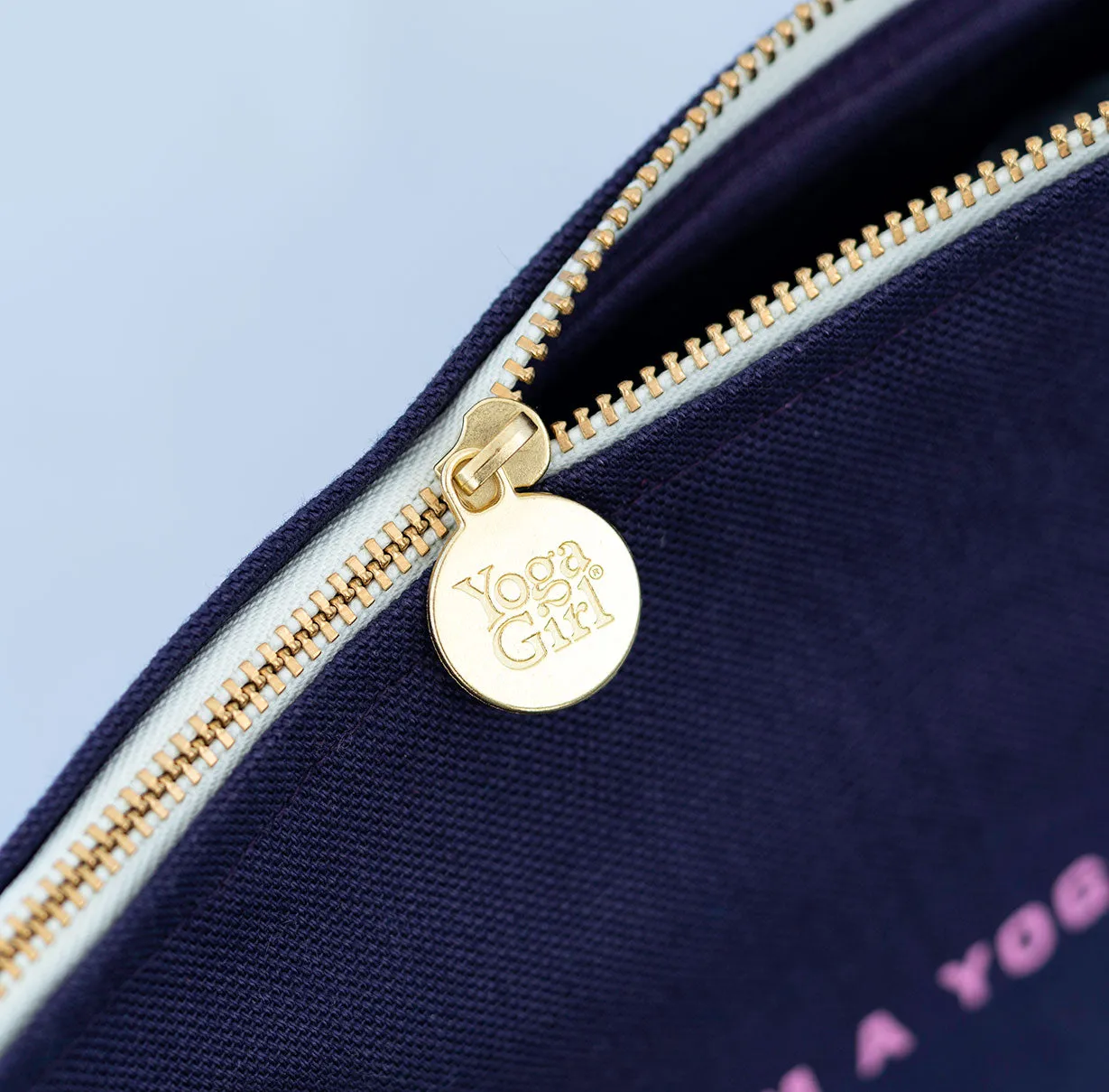 Navy pouch with Yoga Girl logo